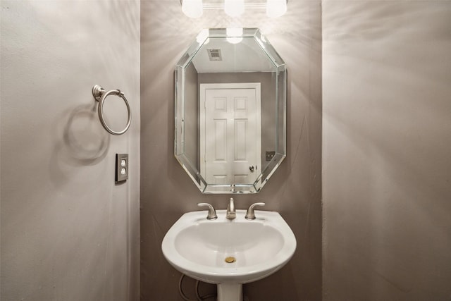 bathroom with a sink and visible vents