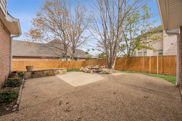 view of yard featuring a patio area and a fenced backyard