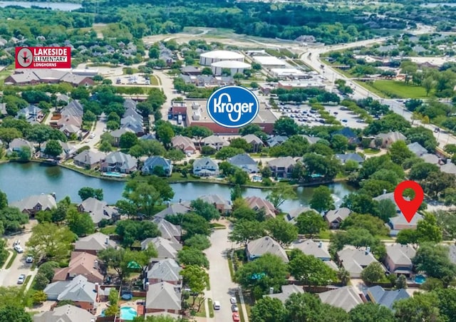 drone / aerial view with a residential view and a water view