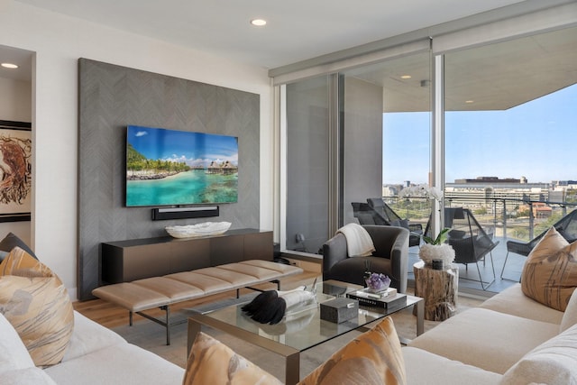 living room featuring recessed lighting, wood finished floors, and expansive windows