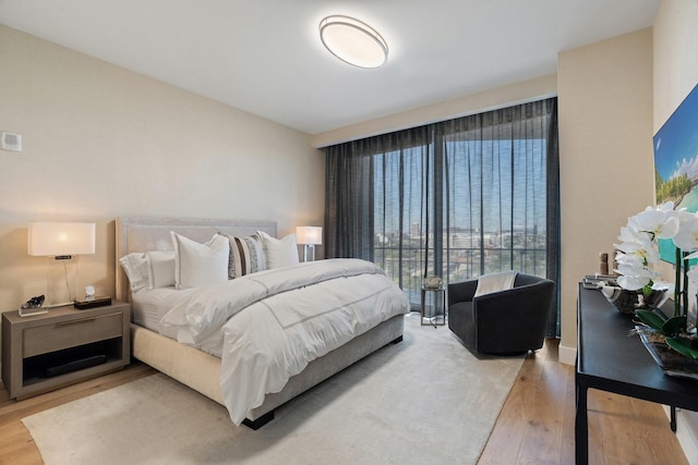 bedroom with wood finished floors