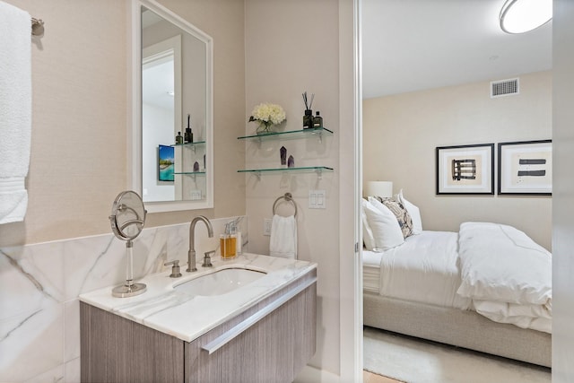 bathroom featuring visible vents and vanity