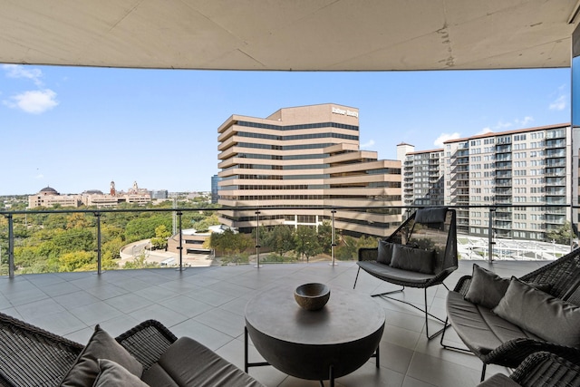 balcony featuring an outdoor hangout area and a view of city