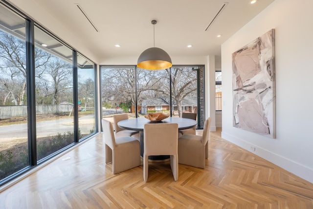 dining room with recessed lighting and baseboards