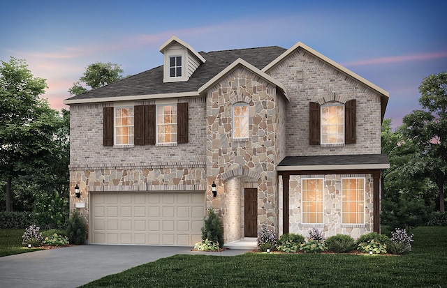 french country style house with driveway, a front lawn, stone siding, an attached garage, and brick siding