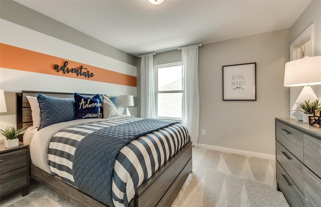 bedroom featuring baseboards and light carpet