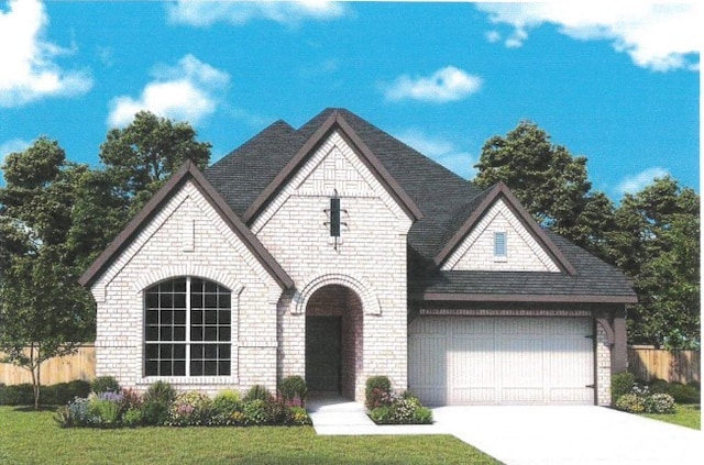 french provincial home with a garage, brick siding, concrete driveway, and fence