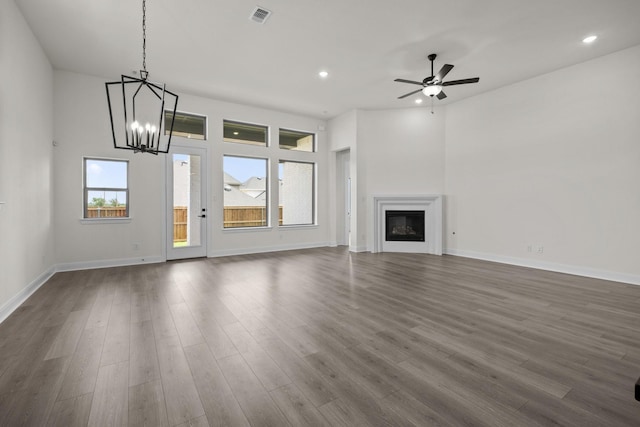 3100 Colt Ln, Celina, TX 75009 - unfurnished living room with a chandelier, dark wood finished floors, ceiling fan, recessed lighting, and baseboards