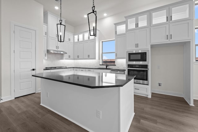 3100 Colt Ln, Celina, TX 75009 - kitchen featuring appliances with stainless steel finishes, white cabinets, a kitchen island, tasteful backsplash, and recessed lighting