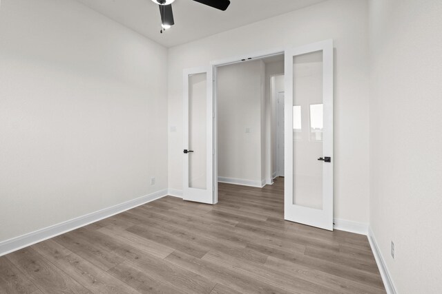 3100 Colt Ln, Celina, TX 75009 - unfurnished bedroom with wood finished floors, baseboards, french doors, and a ceiling fan