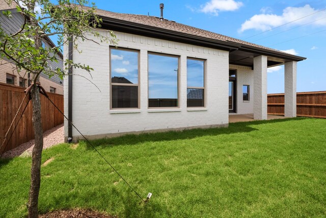 3100 Colt Ln, Celina, TX 75009 - back of property with brick siding and roof with shingles