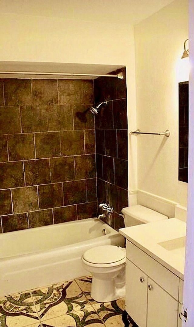 full bath featuring vanity,  shower combination, toilet, and tile patterned floors