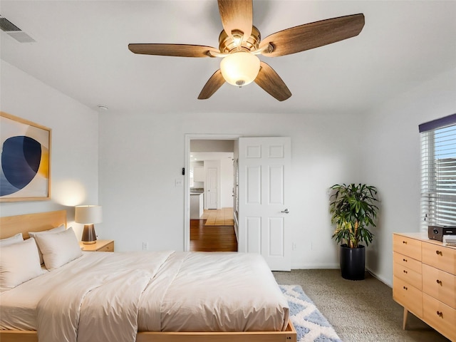 bedroom with visible vents, baseboards, and ceiling fan