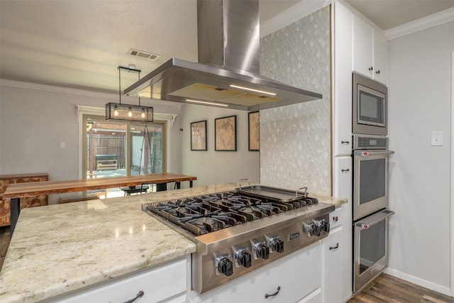 kitchen featuring ornamental molding, stainless steel appliances, exhaust hood, white cabinets, and light stone countertops