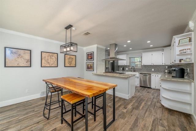 dining area with dark wood finished floors, crown molding, baseboards, and visible vents