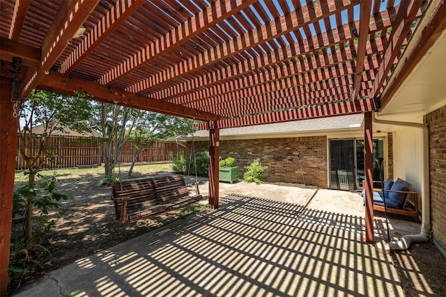 view of patio / terrace with a pergola and fence