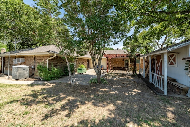 view of yard with a patio area and cooling unit