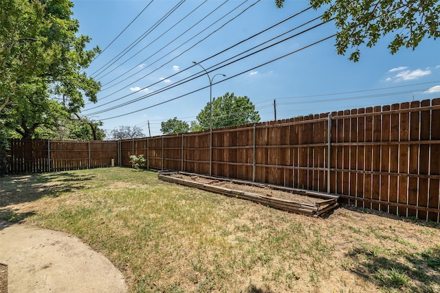 view of yard with a fenced backyard