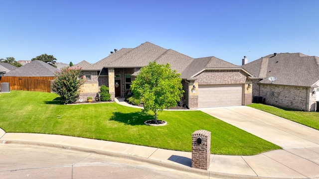 french country inspired facade featuring concrete driveway, an attached garage, brick siding, and a front lawn