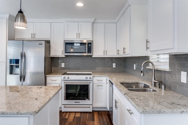 kitchen with white cabinetry, dark wood-style floors, appliances with stainless steel finishes, and a sink