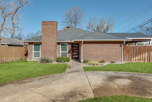 exterior space featuring brick siding, a front lawn, fence, roof with shingles, and a chimney