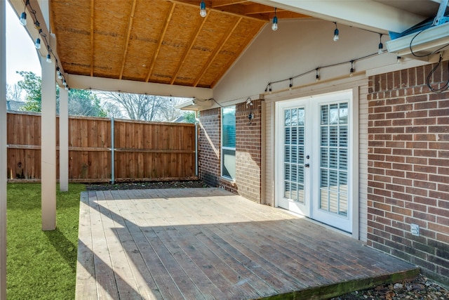 view of patio / terrace featuring french doors, a deck, and fence