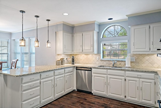 kitchen featuring white cabinetry, a peninsula, a sink, stainless steel dishwasher, and crown molding