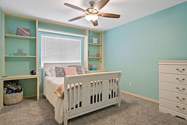 carpeted bedroom with baseboards and a ceiling fan