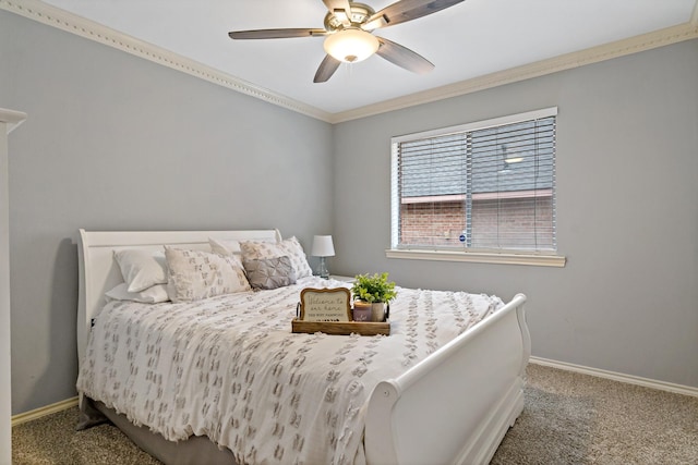 carpeted bedroom with ceiling fan, baseboards, and ornamental molding