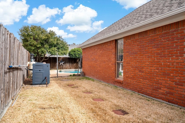 exterior space featuring a fenced in pool and a fenced backyard