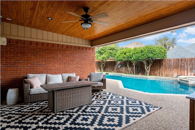 view of swimming pool featuring a pool with connected hot tub, a patio, a fenced backyard, an outdoor hangout area, and ceiling fan