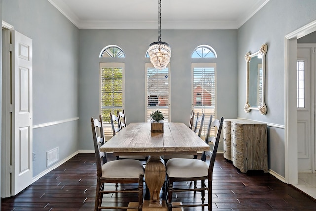 dining room featuring baseboards, visible vents, dark wood-style flooring, and ornamental molding