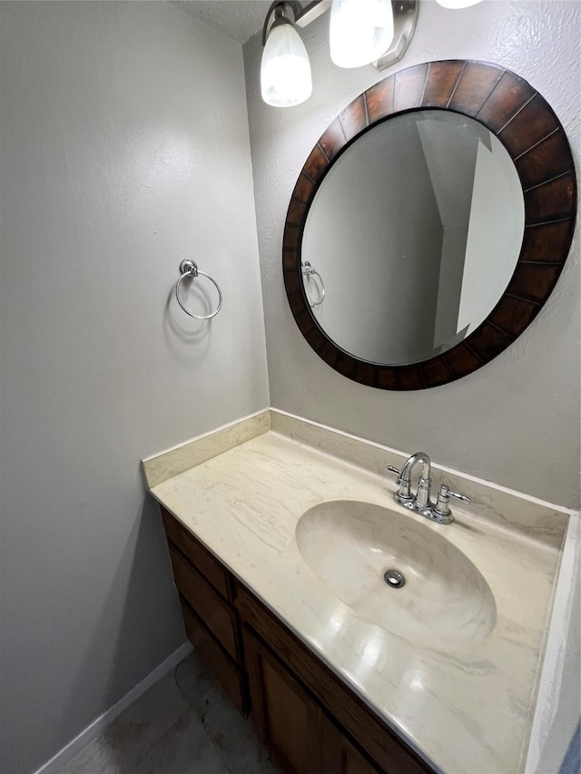 bathroom with vanity and baseboards