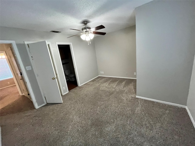 unfurnished bedroom with carpet flooring, baseboards, visible vents, and a textured ceiling