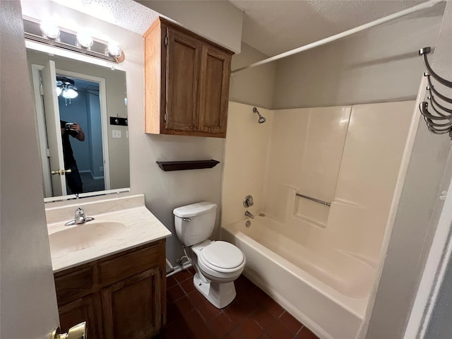 bathroom featuring vanity, shower / tub combination, and toilet