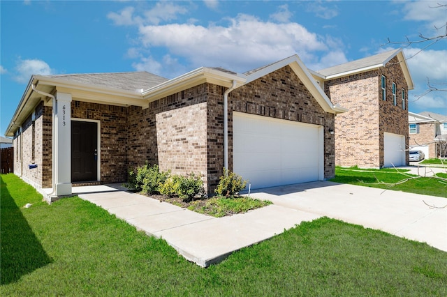 ranch-style home with brick siding, a front yard, and an attached garage