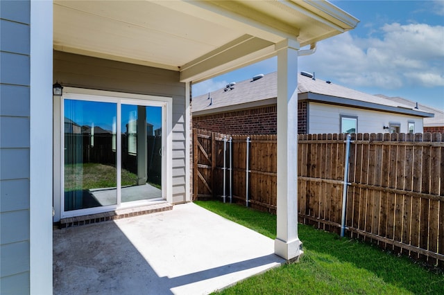 view of patio featuring fence