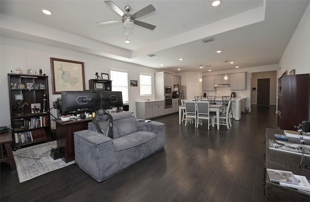 living room featuring recessed lighting, visible vents, and dark wood-style flooring