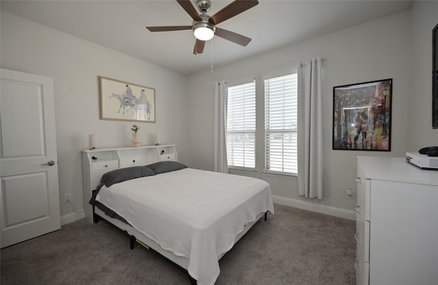 bedroom featuring a ceiling fan, baseboards, and light carpet