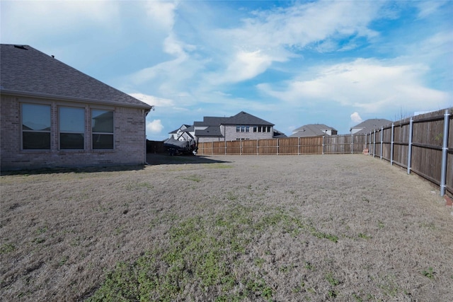 view of yard featuring a fenced backyard