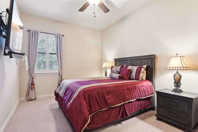 carpeted bedroom featuring baseboards and ceiling fan