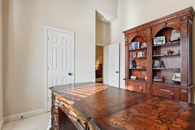 carpeted office with baseboards