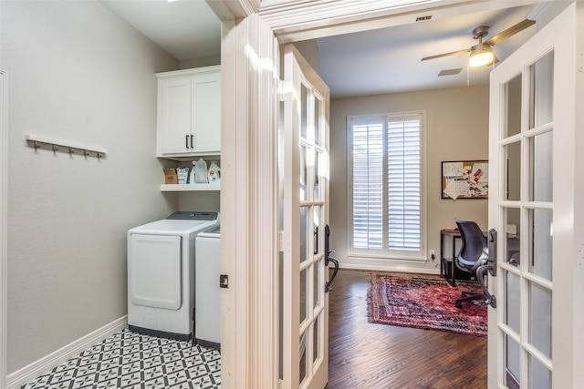 washroom featuring cabinet space, french doors, baseboards, and washer and clothes dryer