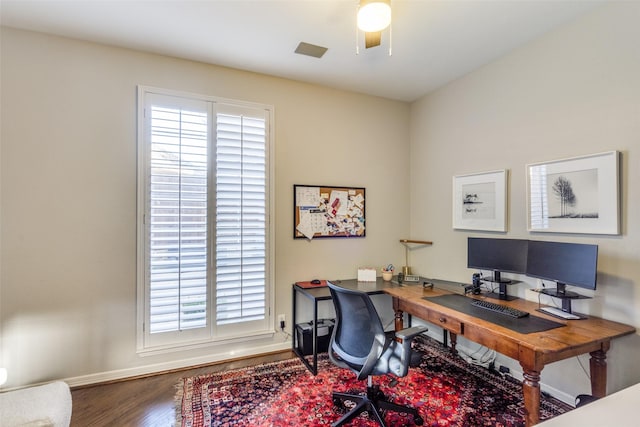 office space featuring ceiling fan, baseboards, and wood finished floors