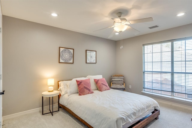 carpeted bedroom with visible vents, recessed lighting, a ceiling fan, and baseboards