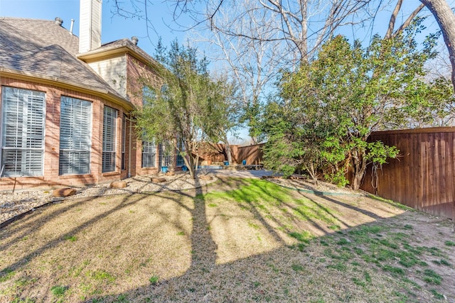 view of yard with a fenced backyard