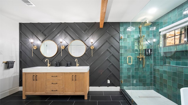 bathroom featuring a stall shower, visible vents, and a sink