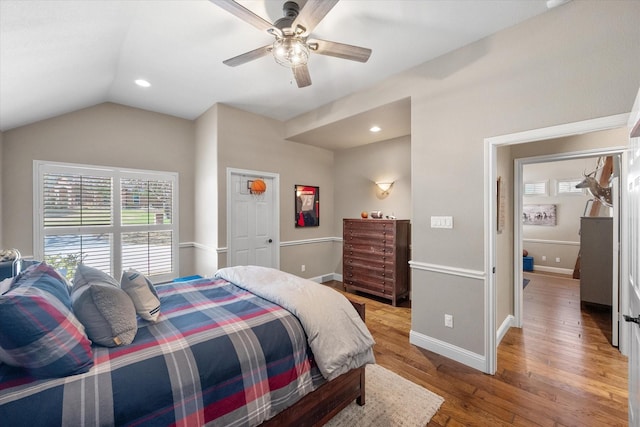 bedroom featuring lofted ceiling, recessed lighting, baseboards, and light wood finished floors