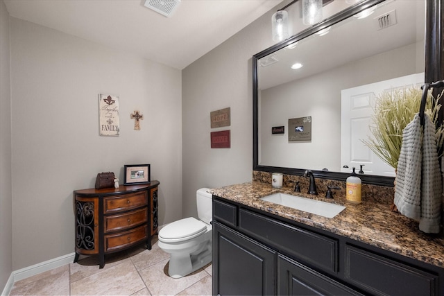 bathroom featuring tile patterned floors, visible vents, toilet, and vanity