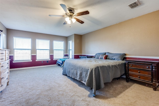 bedroom featuring visible vents, ceiling fan, baseboards, and carpet